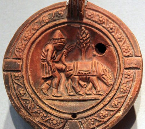 A Roman Clay Lamp Depicting a Man and His Donkey: A Glimpse into Ancient Life