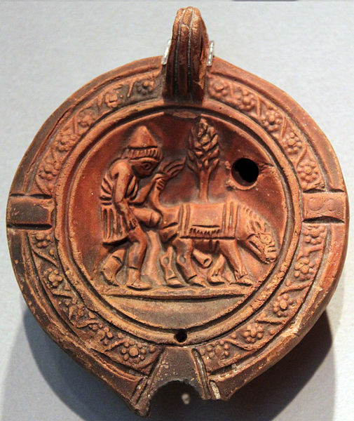 A Roman Clay Lamp Depicting a Man and His Donkey: A Glimpse into Ancient Life